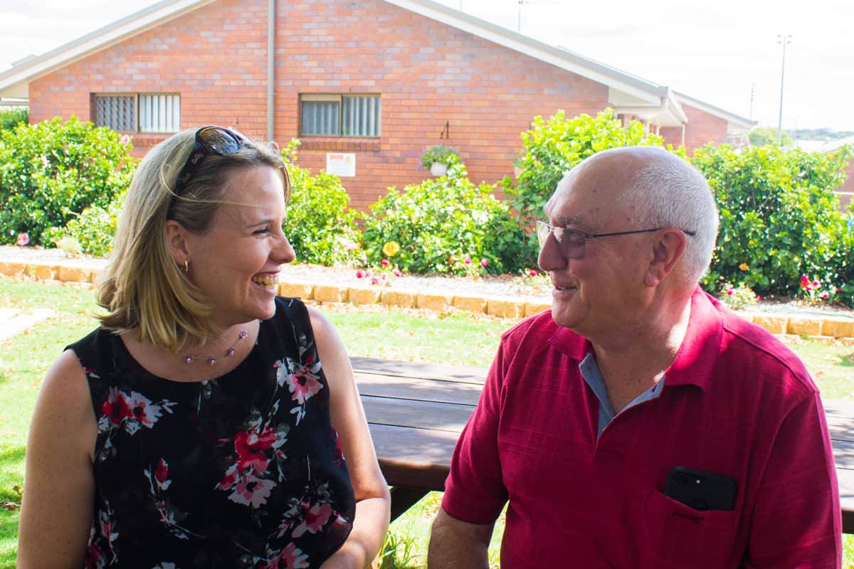 Melanie Mullen chatting with a Yukana resident.