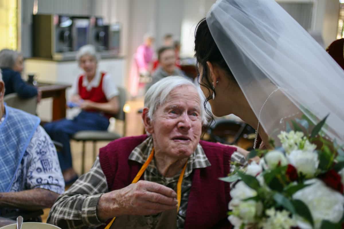 Bride receiving good wishes from a Yukana resident