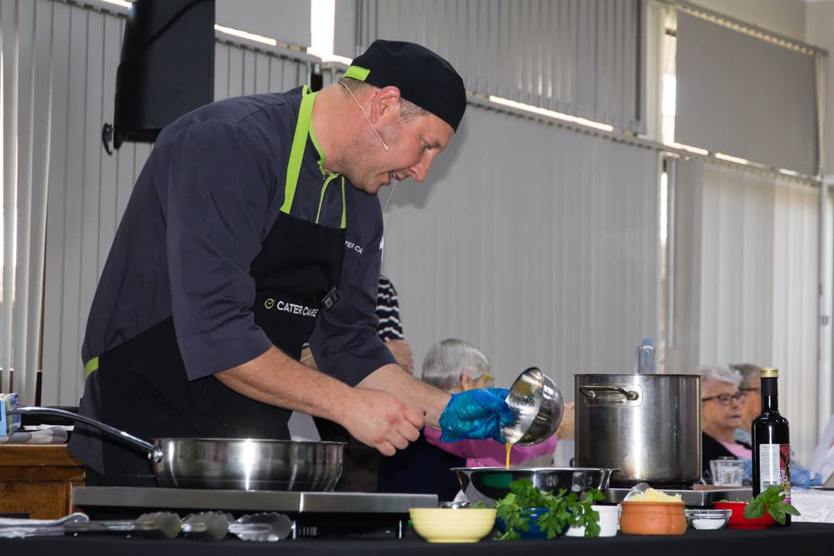 Chef in action at cooking demonstration