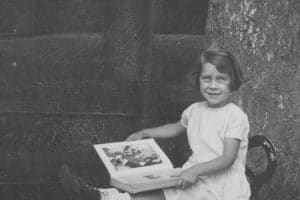 Betty reading in Bristol Park, England
